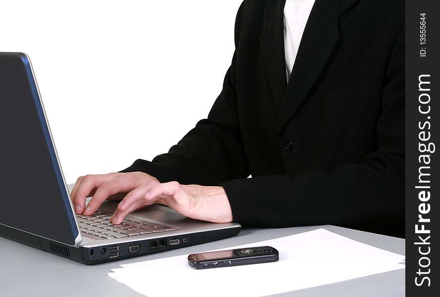 The successful young businessman using laptop