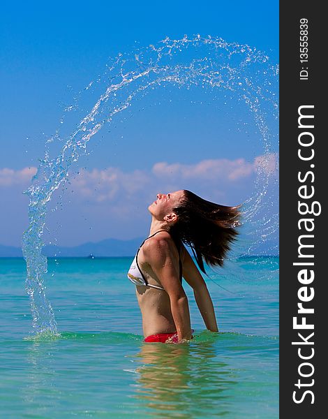 Girl with long hair playing in the sea. Girl with long hair playing in the sea