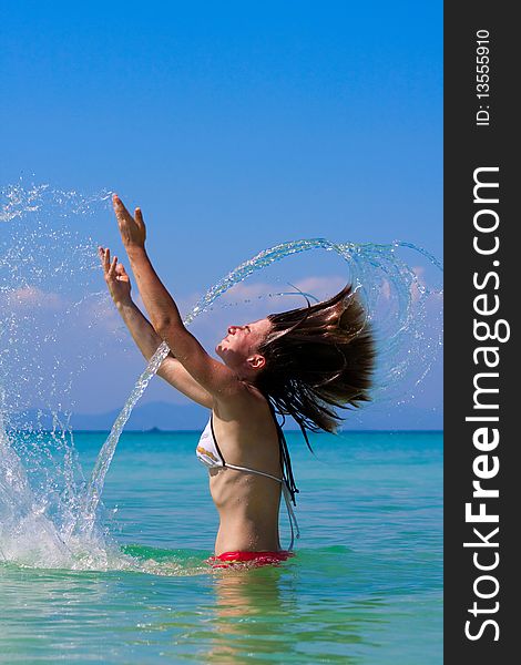 Girl with long hair playing in the sea. Girl with long hair playing in the sea