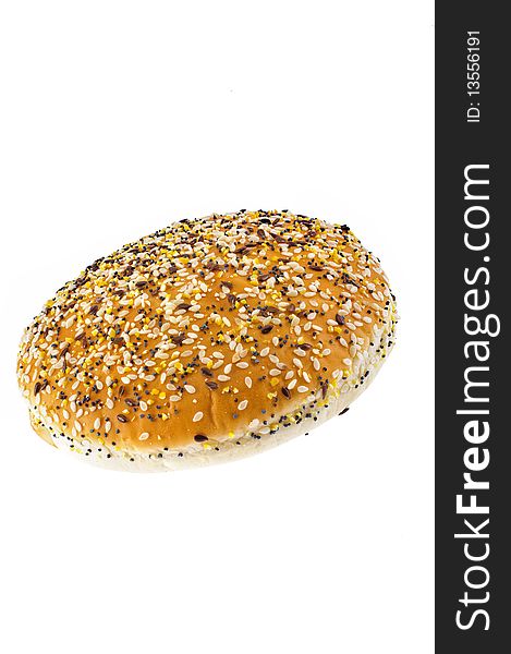 Appetizing bun with sesame isolated on white