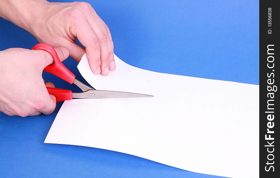 Cutting Paper with Scissors white