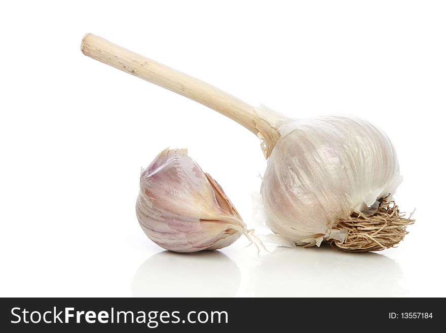 Garlic head detail isolated on a white background. Garlic head detail isolated on a white background