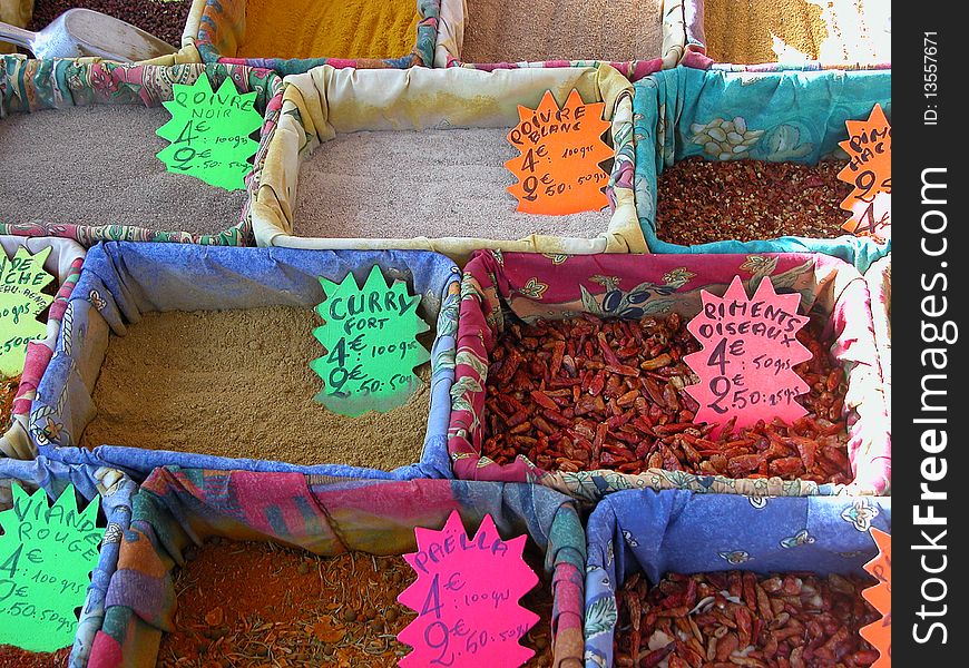 Colours and textures with herbs and spices on a market stall on the Cote d'Azur. Colours and textures with herbs and spices on a market stall on the Cote d'Azur