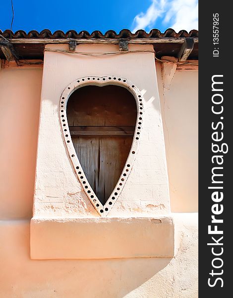 Heart shape windows. Detail of facade from vintage colonial building in Santiago de Cuba, Cuba