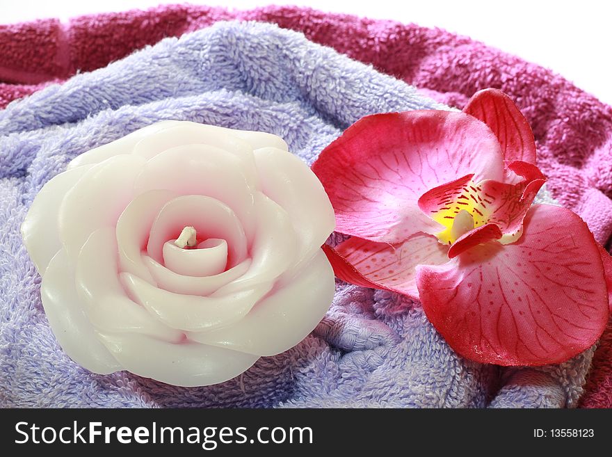 A spa items composition with flower and candle.