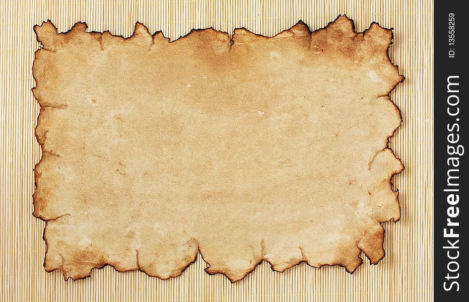 Old paper on bamboo background