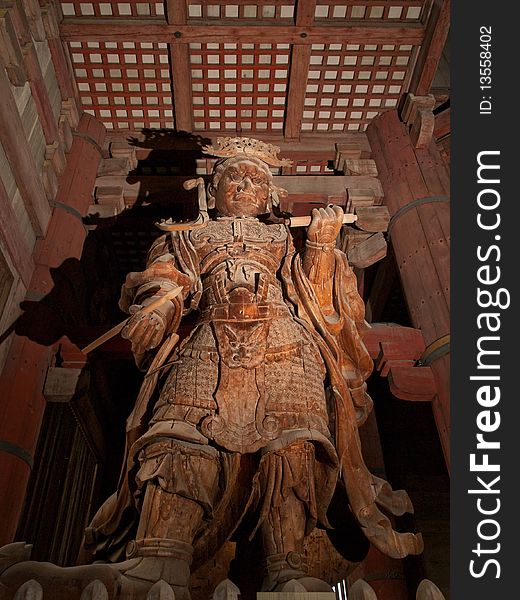 Guardian statue inside Todai Ji temple in Nara