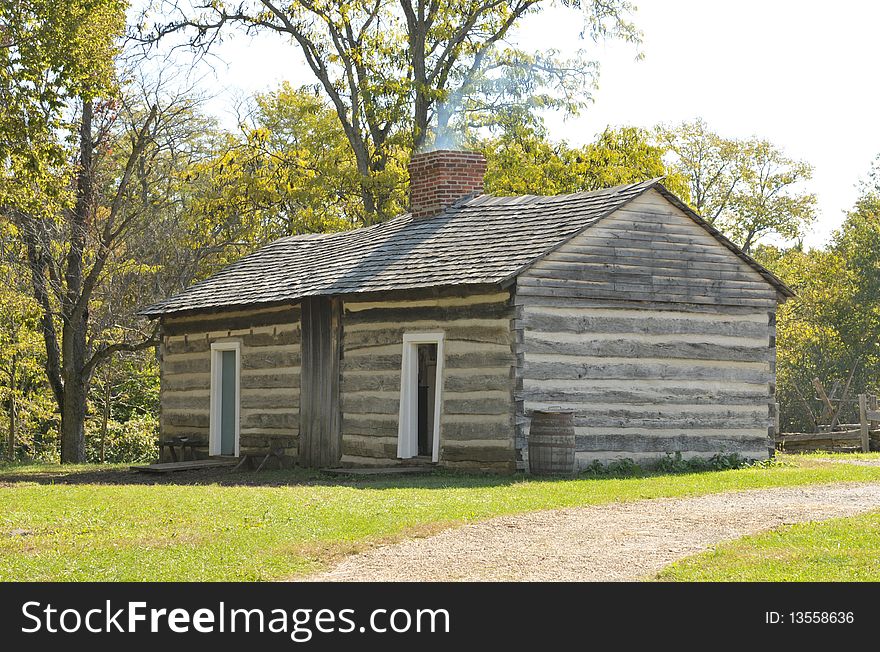 Replica of Thomas Lincoln's log cabin.  He was the father of President Abraham Lincoln.  In 1893, the original Thomas Lincoln log cabin was disassembled and shipped northward to serve as an exhibit at the World's Columbian Exposition in Chicago, Illinois. The original cabin was lost after the Exposition, and may have been used as firewood. However, the cabin had been photographed many times, and an exact replica was built from the photographs and from contemporary descriptions.  The reconstruction of the Thomas Lincoln log cabin was completed in 1934.