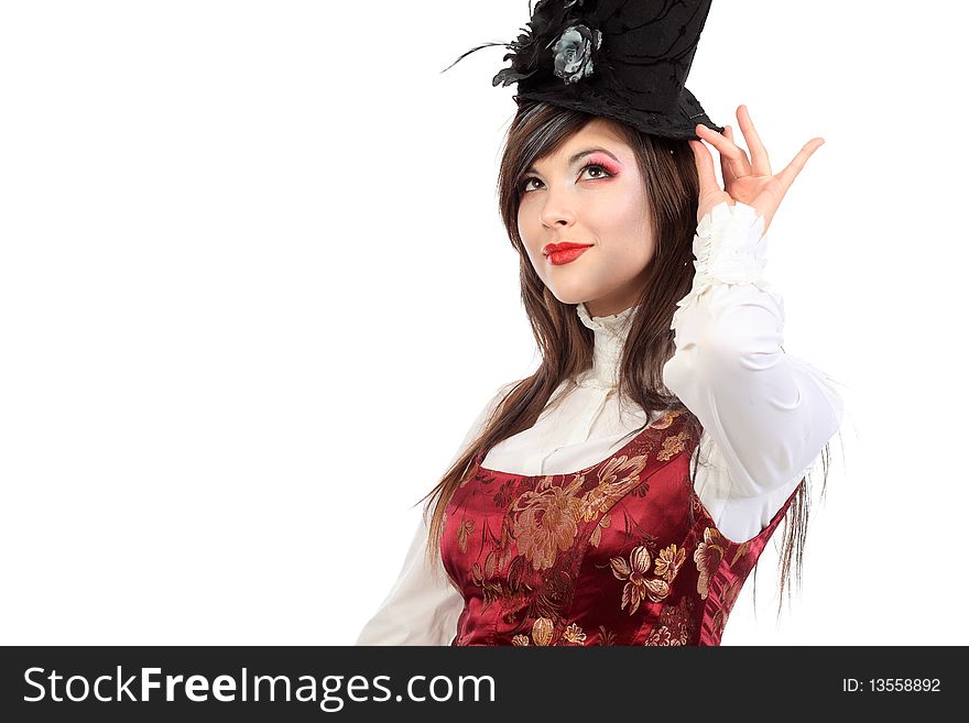 Portrait of the elegant young woman in 19th century costume holding walkingstick in her hands. Shot in a studio. Portrait of the elegant young woman in 19th century costume holding walkingstick in her hands. Shot in a studio.