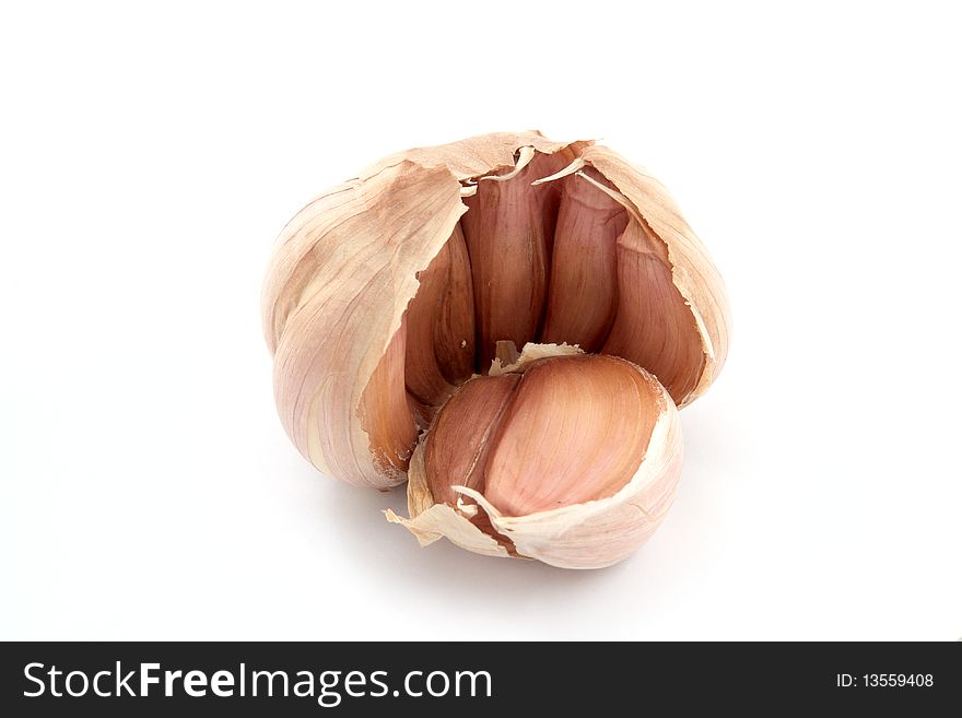 Garlic  and cloves on white background