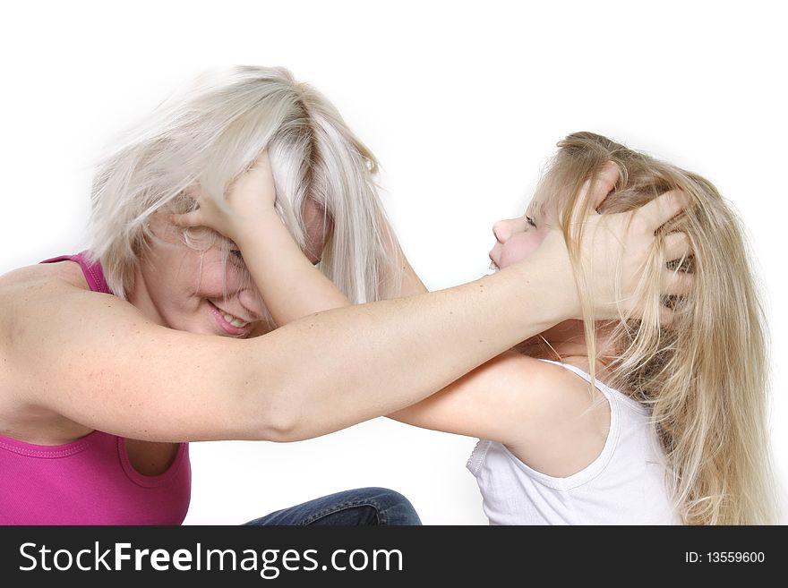 Studio shot of playing mother and daughter