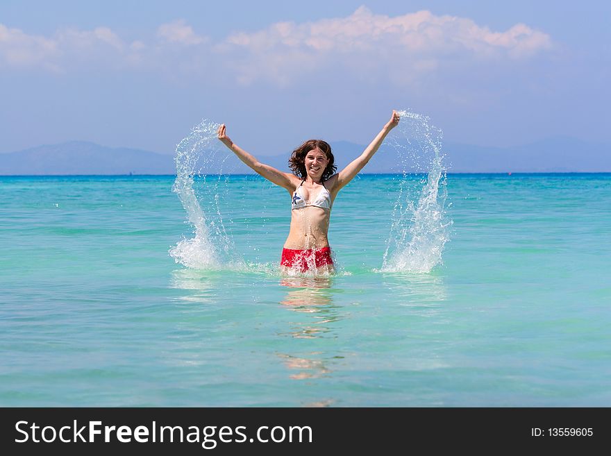 Girl with long hair playing in the sea. Girl with long hair playing in the sea