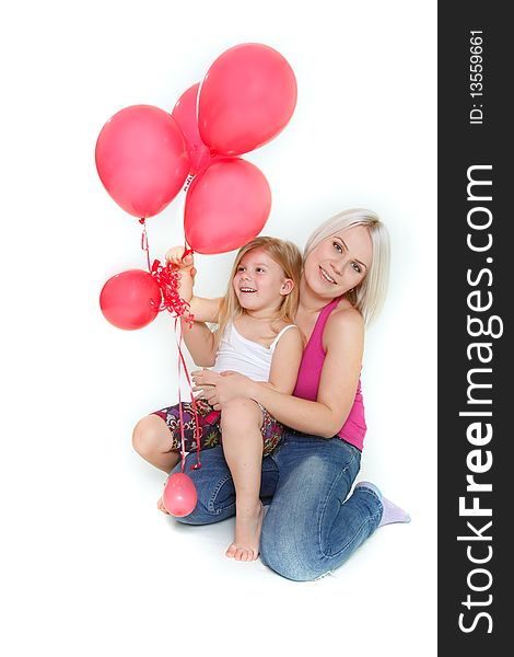 Happy mother and daughter with red balloons over white