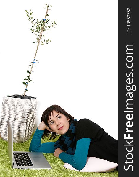 Woman with laptop dreaming about the future with olive tree in background. Woman with laptop dreaming about the future with olive tree in background