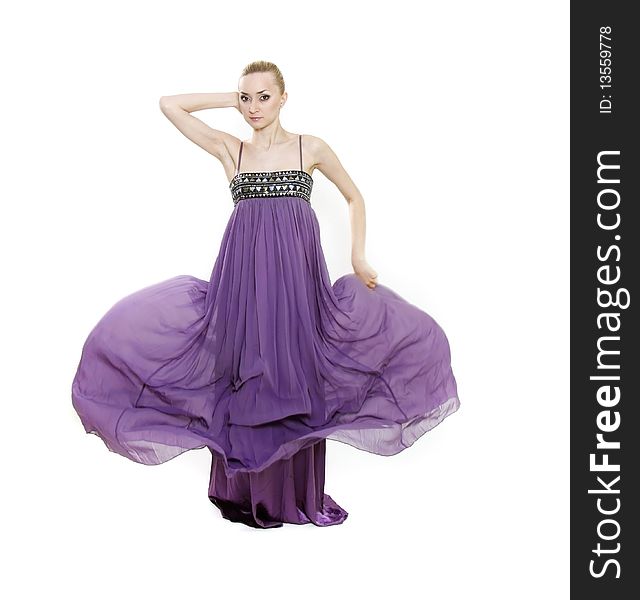 Young beautiful woman in long purple dress