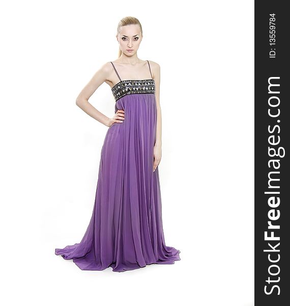 Young beautiful woman in long purple dress