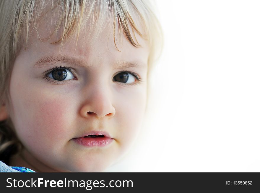 Thoughtful little girl is by window portrait. Thoughtful little girl is by window portrait