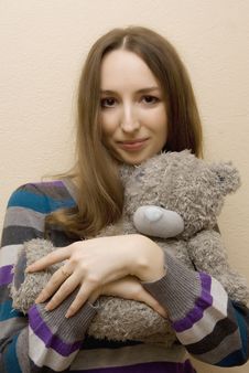 Girl Embraces A Bear Stock Photography