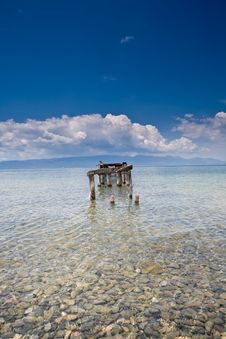 Decayed Jetty In A Lake Blue Skies Clear Water Wit Stock Photo Decayed Jetty In A Lake Blue Skies Clear Water Wit Stock Photo