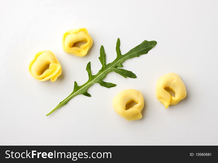 Tortellini pasta and arugula leaf - studio