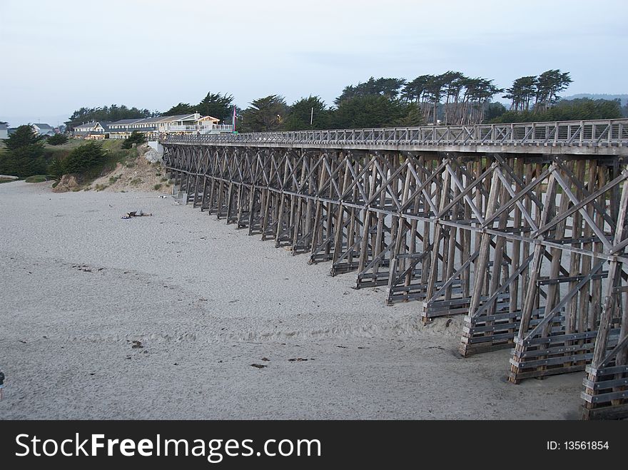 Wooden Bridge Over Beach