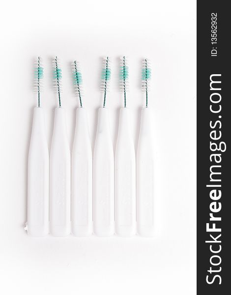 Some white toothbrush on white background (close up)