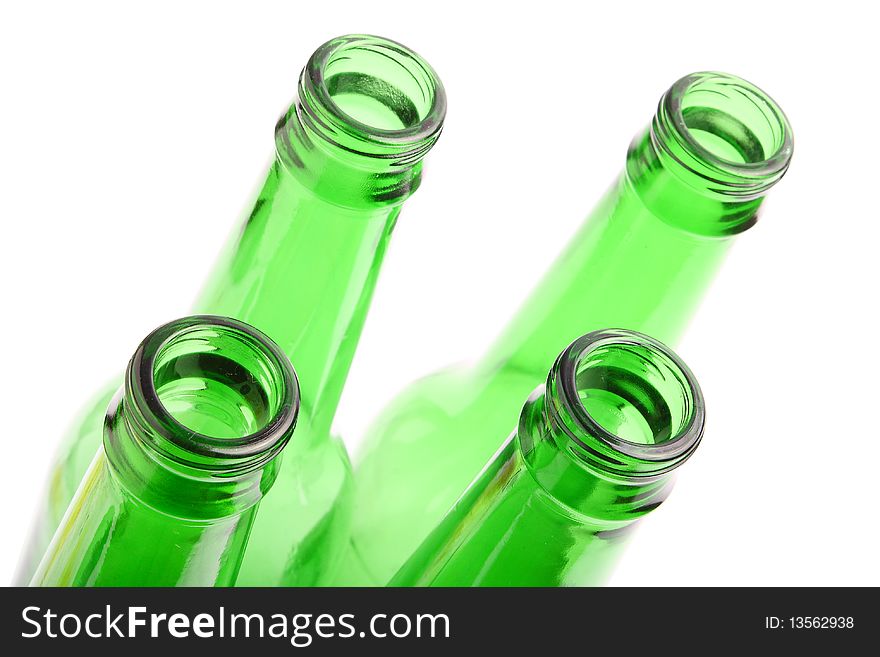 Green glass empty bottle on white background