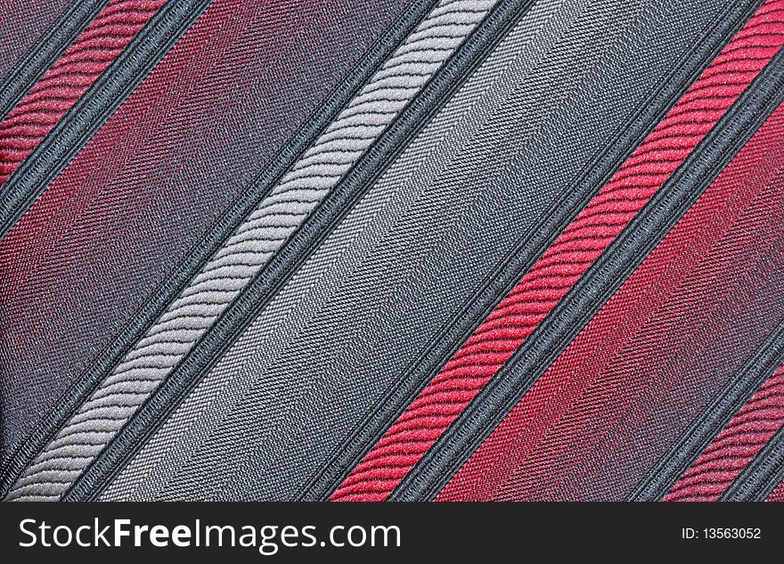Red, gray and black diagonal patterned fabric for background. Red, gray and black diagonal patterned fabric for background