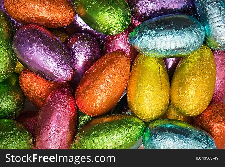 Variety chocolate easter eggs wrapped in colorful shiny foil. Variety chocolate easter eggs wrapped in colorful shiny foil