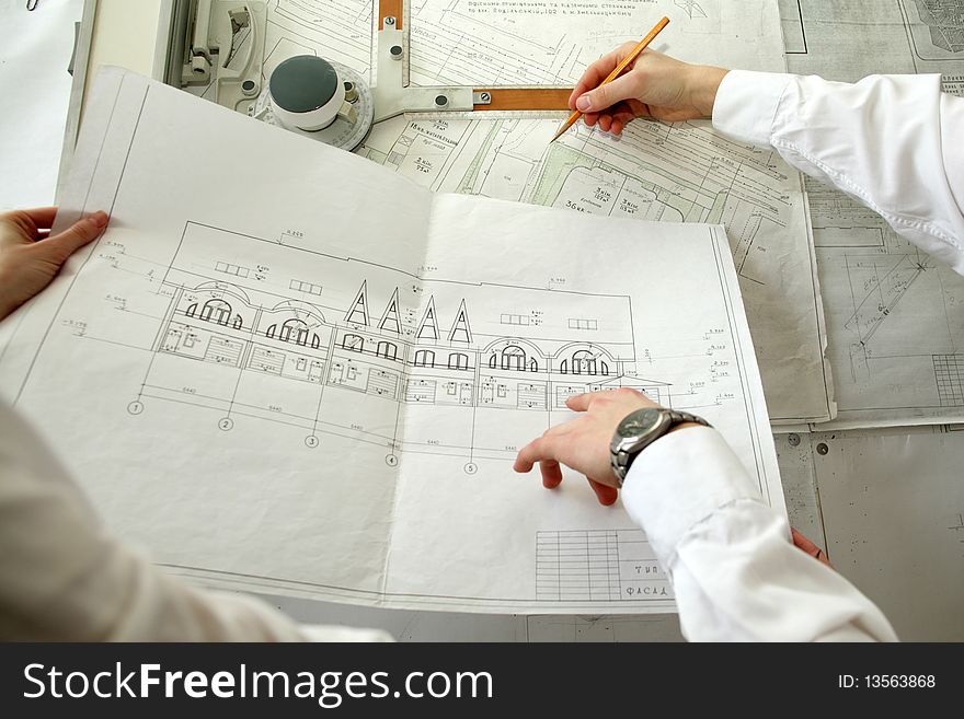 An image of two architects working at the project