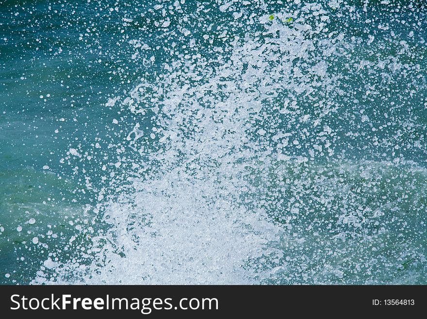 Sea waves splashing on rocks