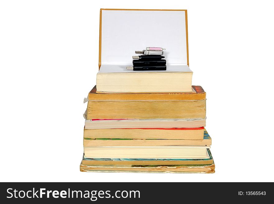 Stack of books and memory on the top, isolated on white