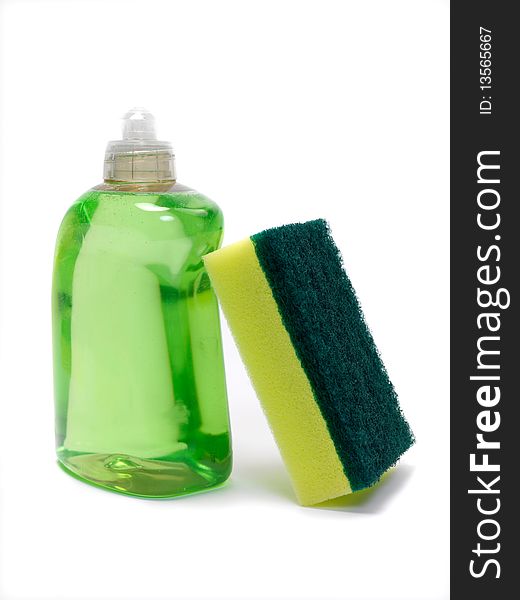 Household scourers stacked against dishwashing detergent and isolated against a white background. Household scourers stacked against dishwashing detergent and isolated against a white background