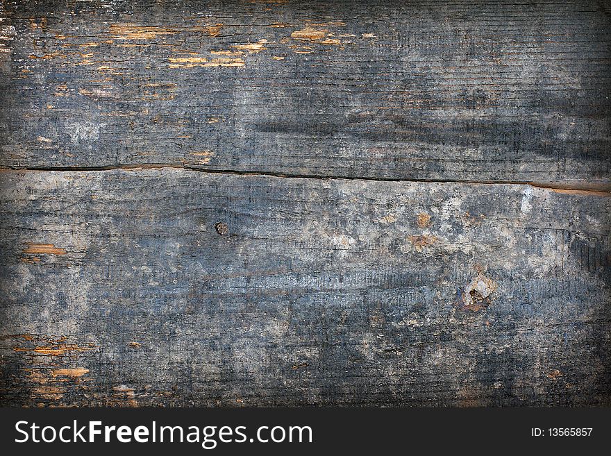 Grunge wooden background. Very old and worn wooden plank