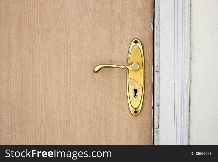 Old Wooden door finishing is remaining with brass lock