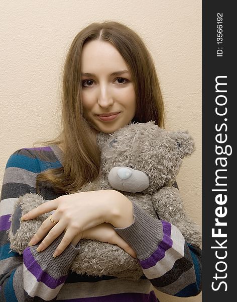 Girl Embraces A Bear