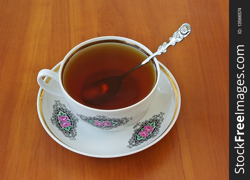 Teacup with spoon on saucer