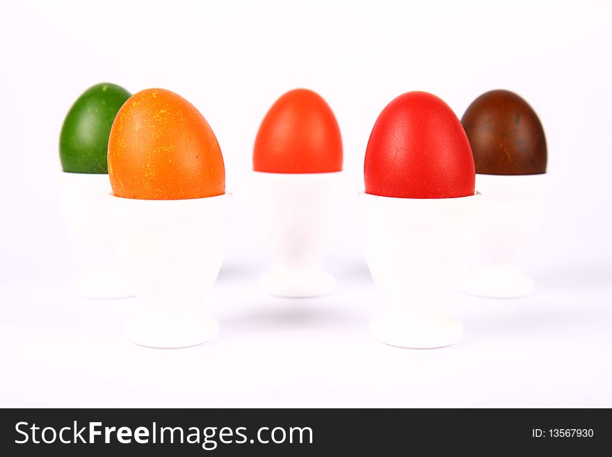 Colorful eggs in egg holders