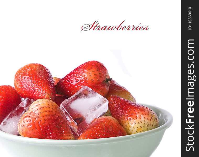 Ice cubes and strawberries on white background