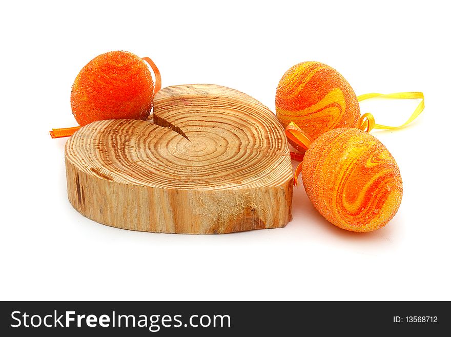 Easter eggs and a wooden heart on a white background