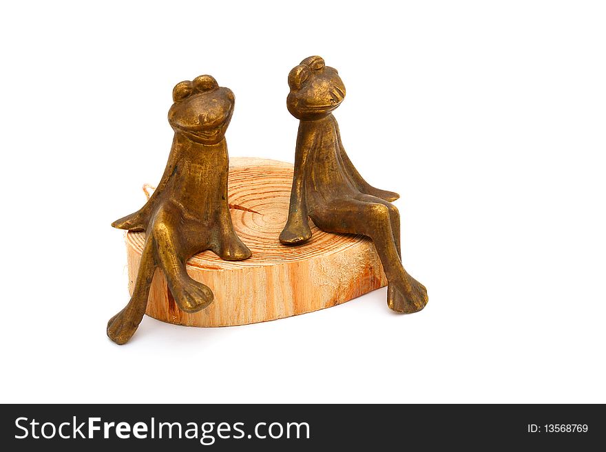 Frogs of bronze on a white background