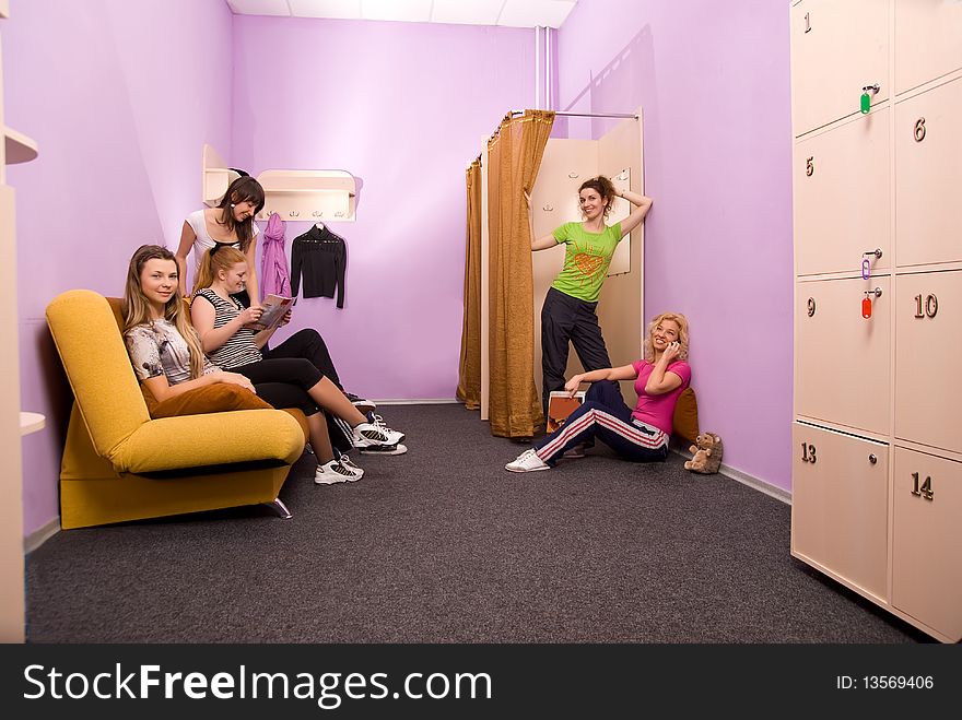 Girls in the locker room preparing for occupations in the fitness center