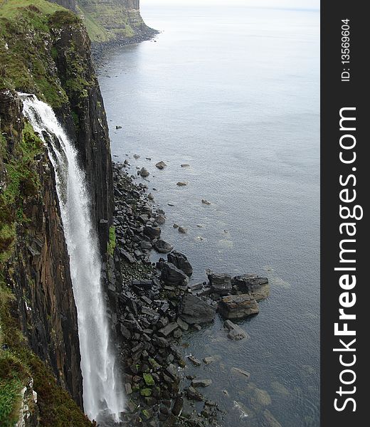 Kilt rock waterfall tumbles from the lealt gorge into the sea on the Isle of Skye in Scotland
