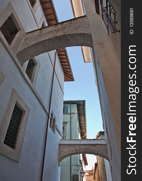 A view of ancient arches in a charateristic alley of old medieval town of Umbria Region (Italy). A view of ancient arches in a charateristic alley of old medieval town of Umbria Region (Italy)