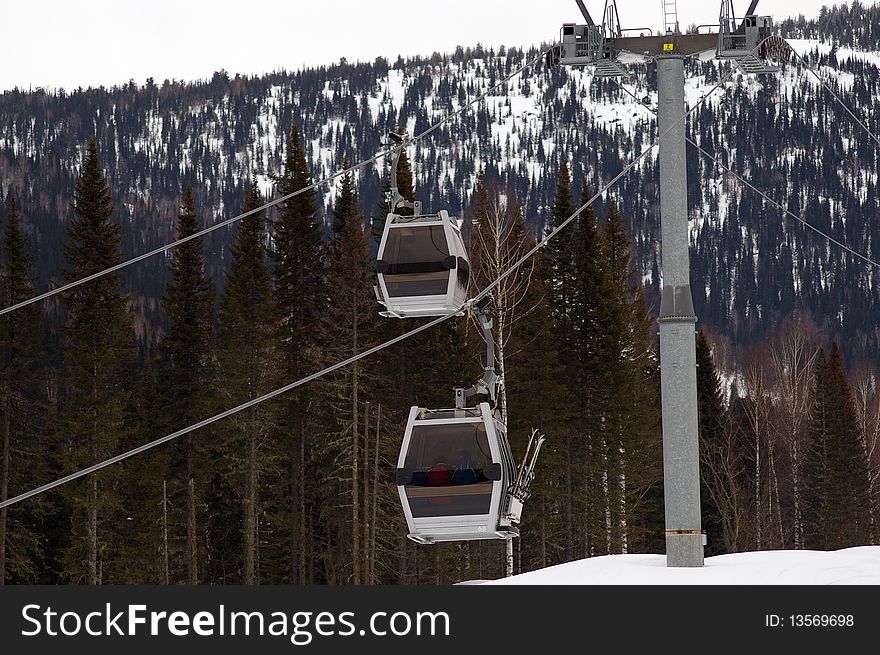 Gondola ski lift on the alpine skiing track. Gondola ski lift on the alpine skiing track