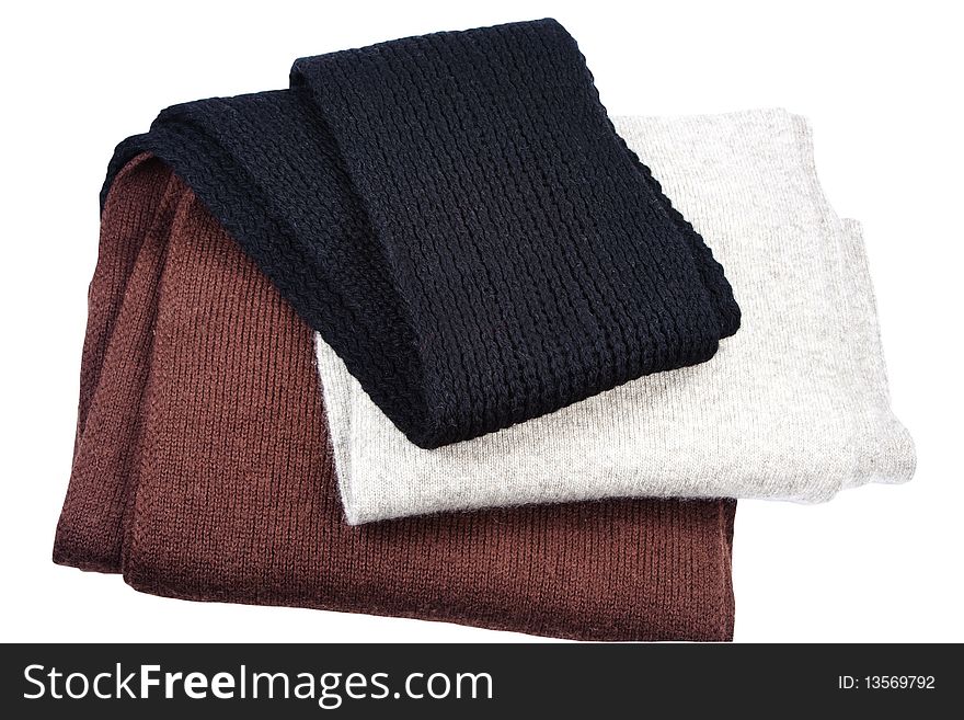 Three woolly scarfs are insulated on white background