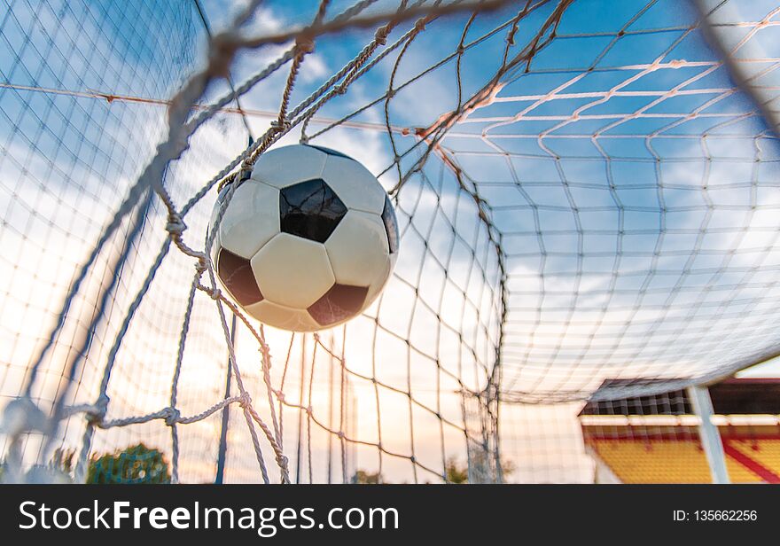 Soccer ball flying in the net