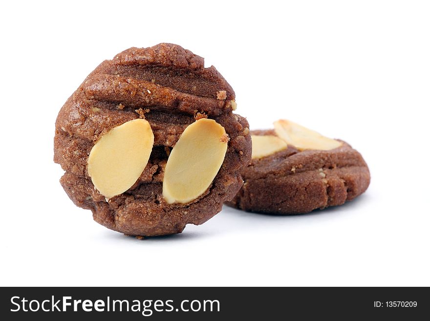 Two pieces of almond cookies isolated on white background.