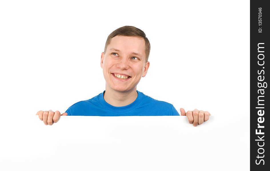 Young man looking over a blank board