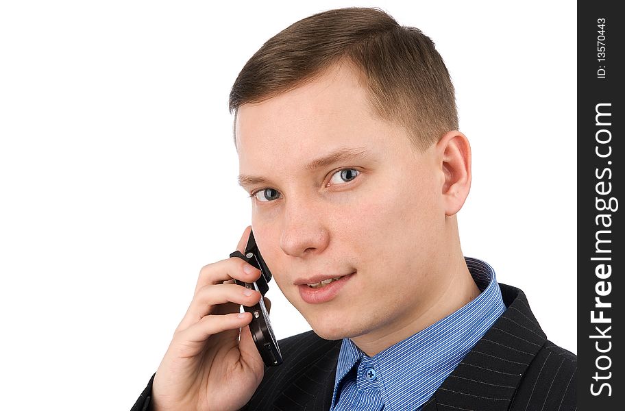 Businessman talking on his mobile phone isolated on a white